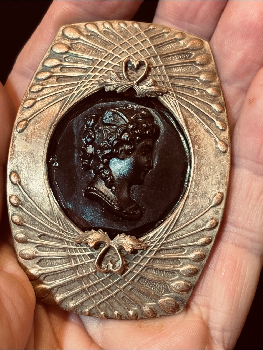 Antique gold tone black glass cameo brooch
